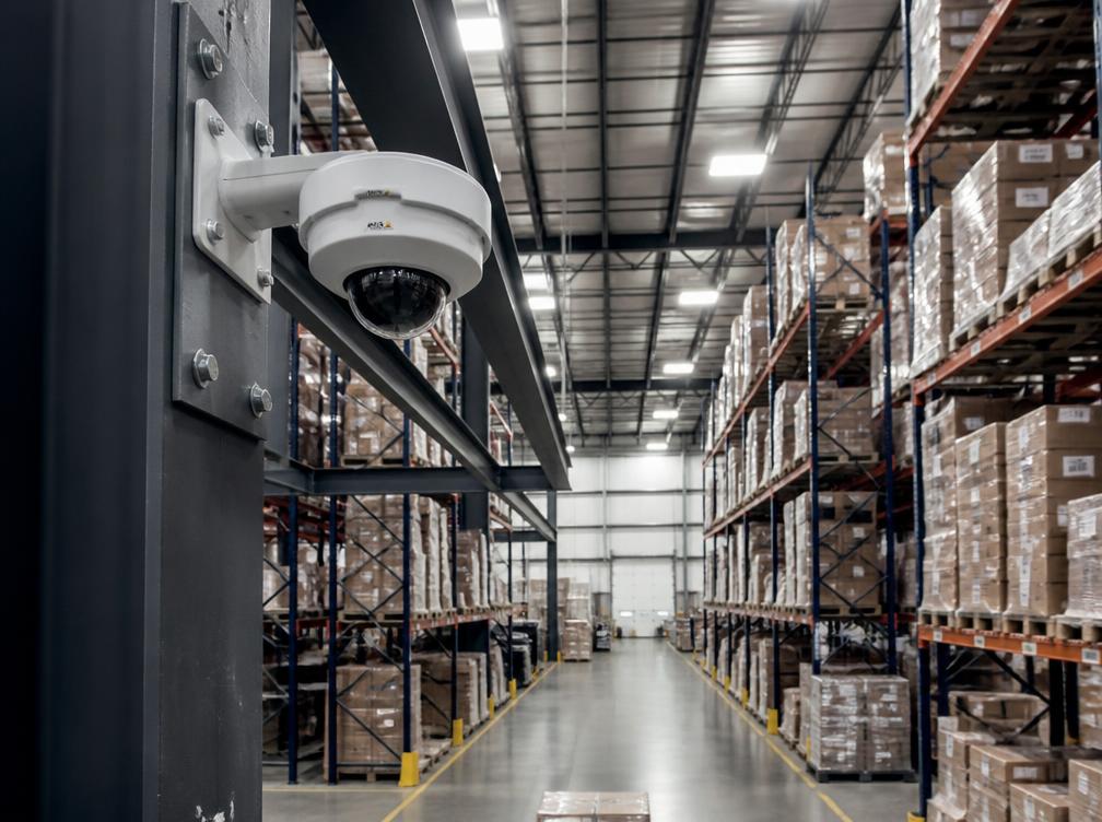 Surveillance camera mounted on a warehouse beam
